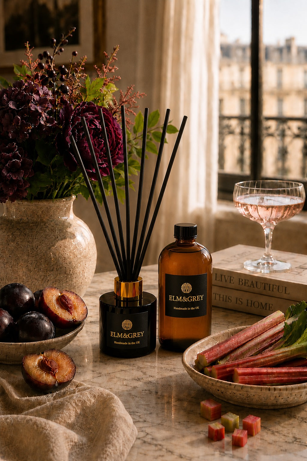 Elm and Grey Black Plum and Rhubarb reed diffuser and refill bottle with dark plums, rhubarb and purple florals in a Parisian setting