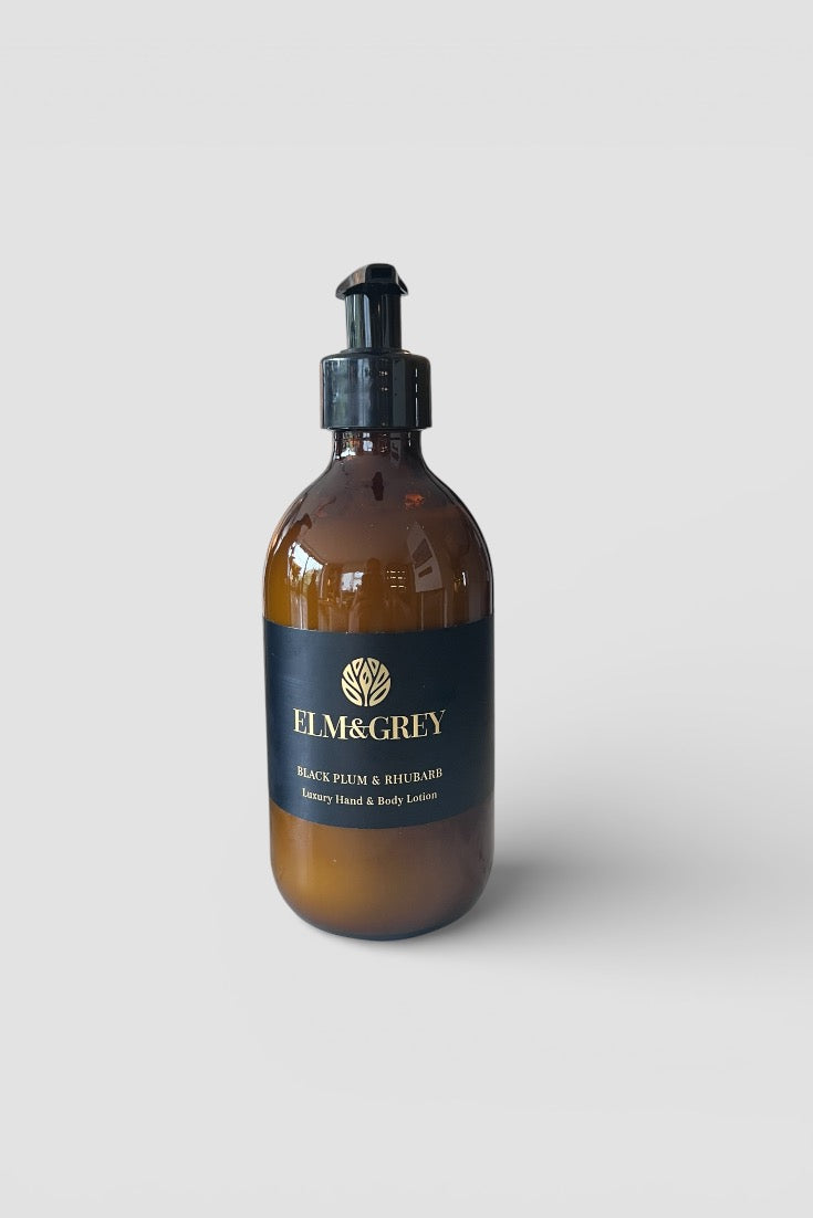 AMBER GLASS bottle with black cap and label on a white background