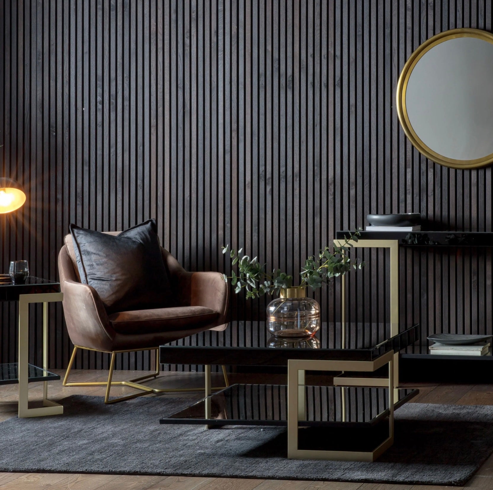 Modern living room with a brown armchair, coffee table, and decorative elements.