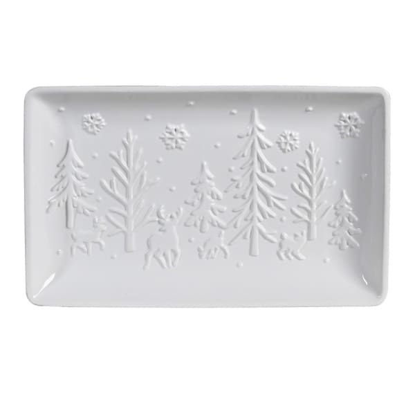 Rectangular white ceramic tray with embossed winter scene design on a white background