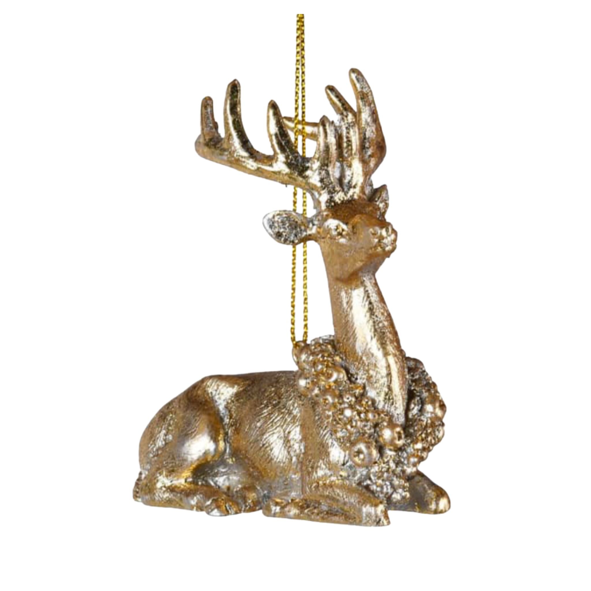 A golden deer bauble with a decorative collar