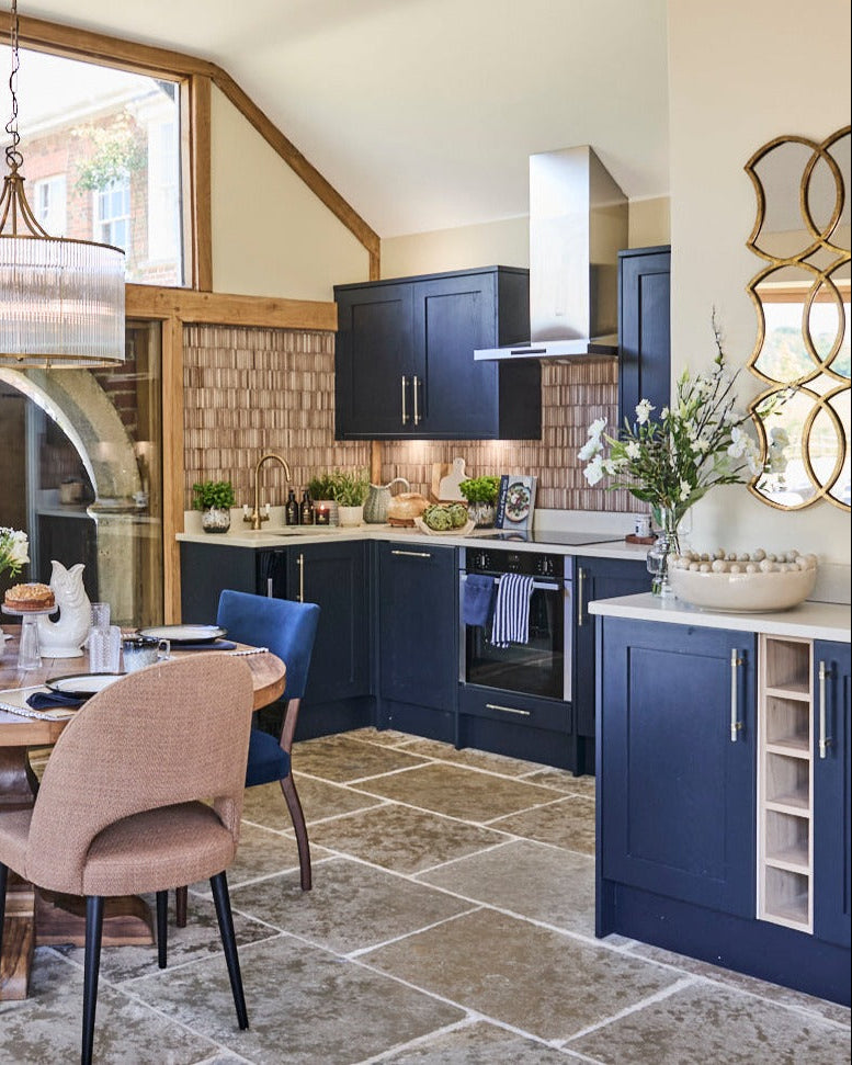 Blue and cream kitchen scene with cream bobble bowl glug jug white urchin jugs and stone floor