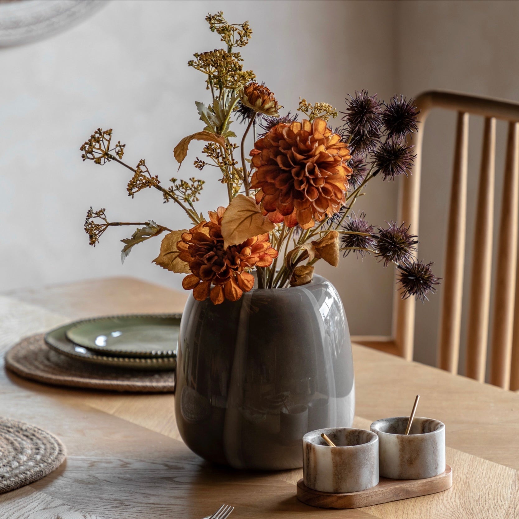 Decorative vase with flowers on a table setting