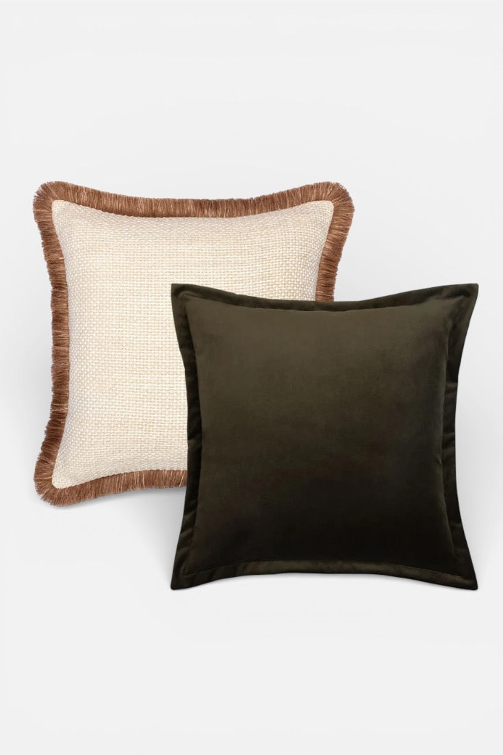 Two cushion, one with a textured brown border and white background, the other solid deep juniper green, on a light grey background.