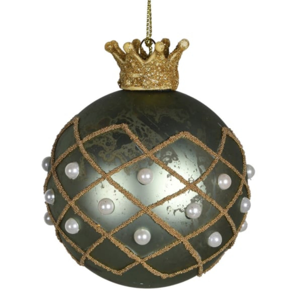 green bauble adorned with pearls and a gold crown