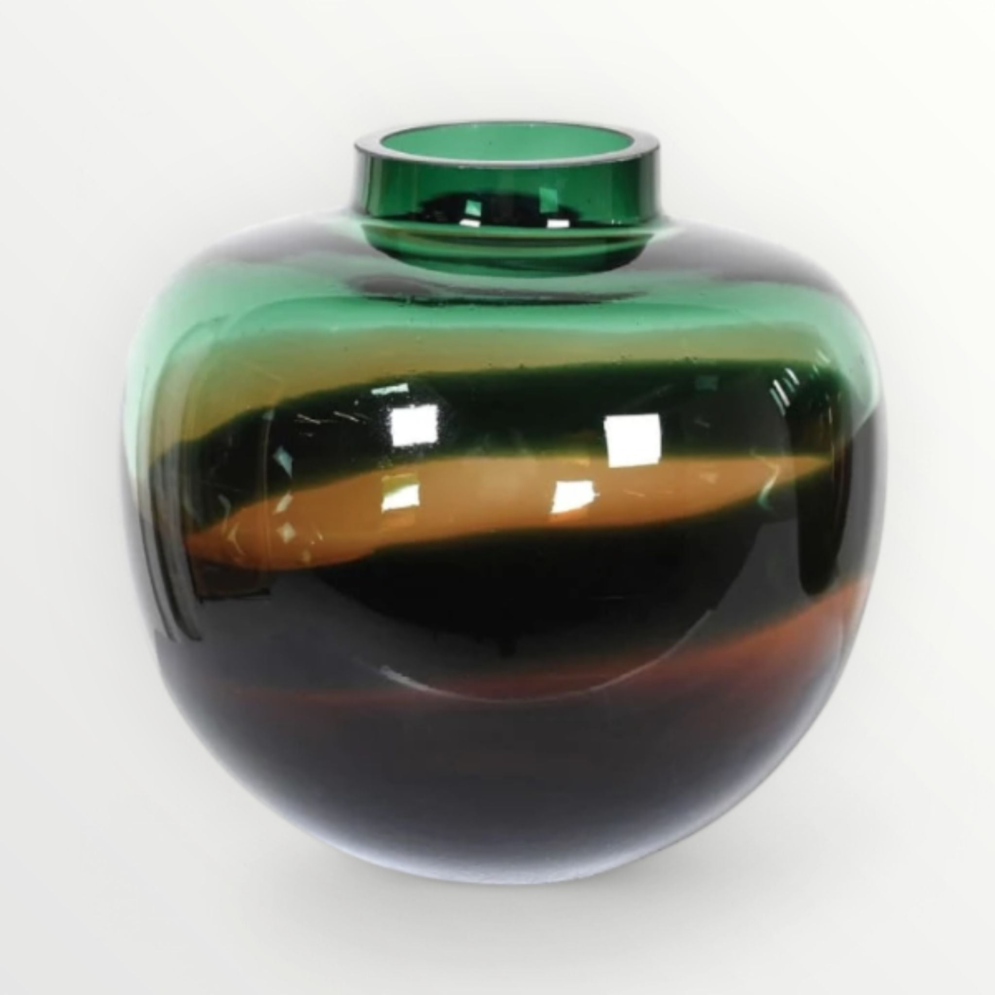 Green and black glass vase on a white background