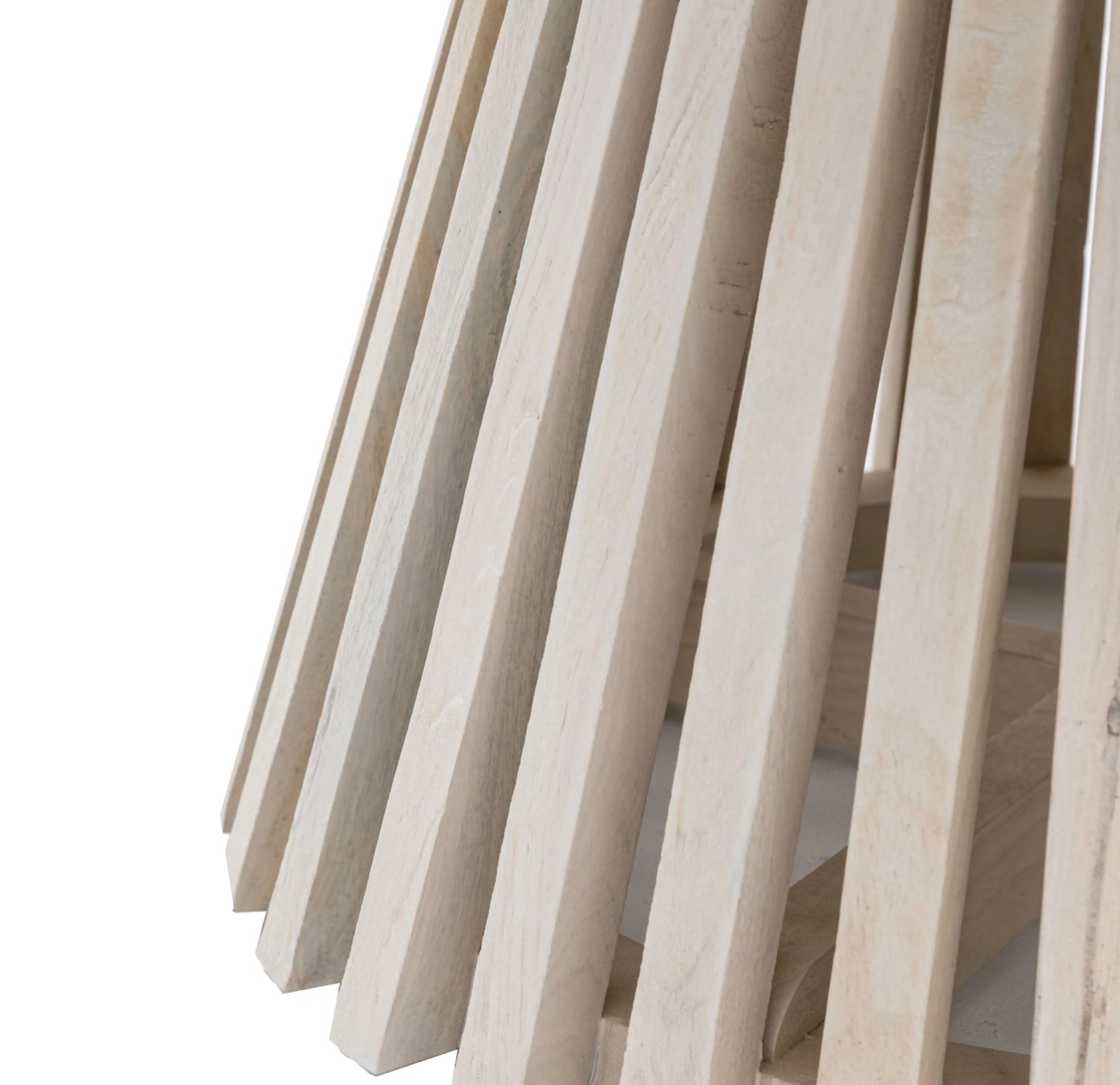 Close-up of light wooden slats on a white background
