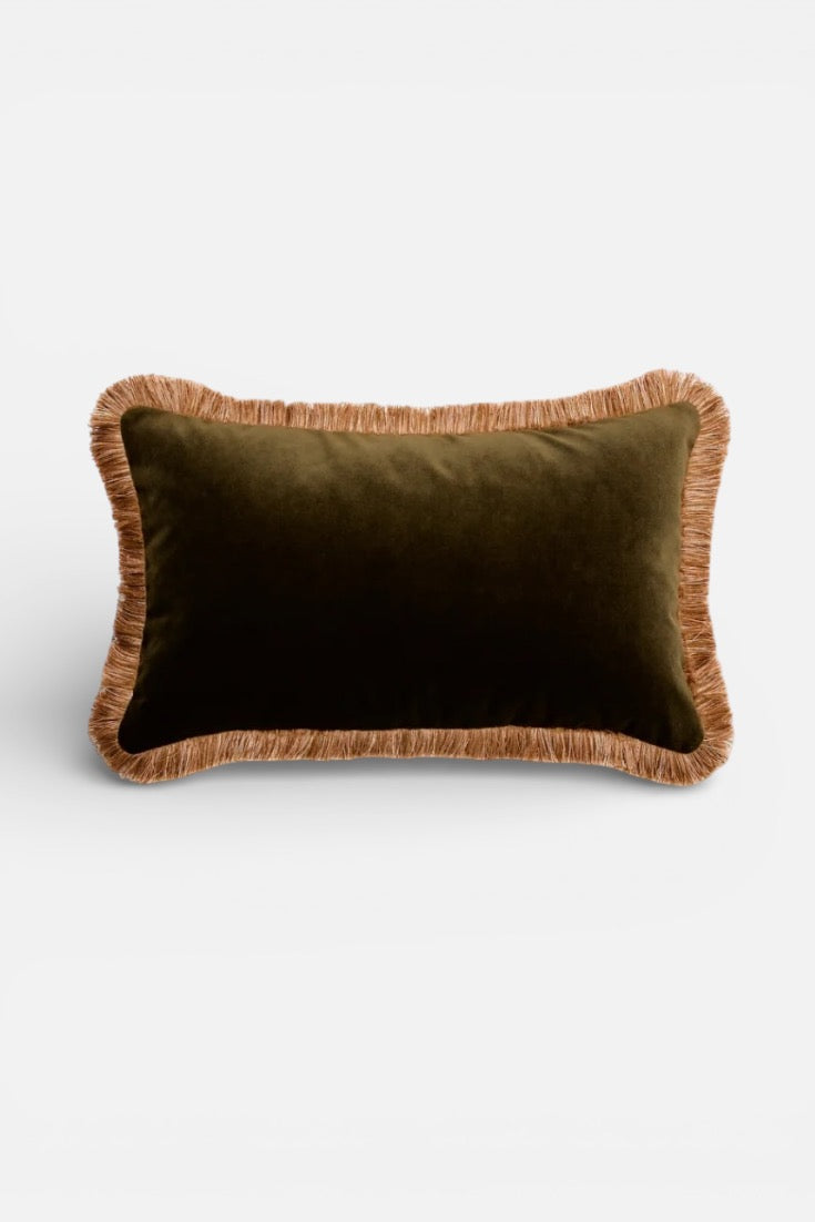 Green pillow with brown frayed edges on a white background