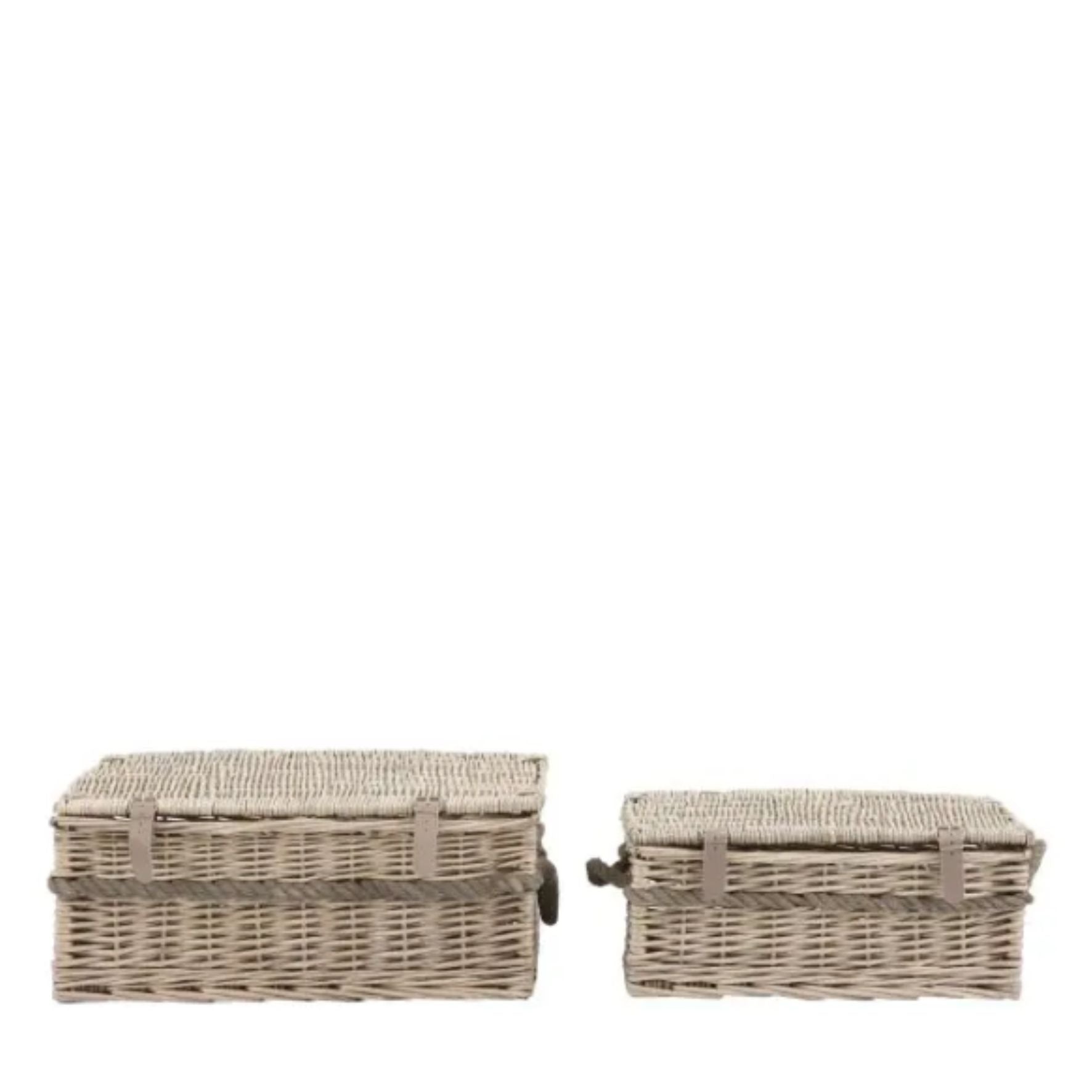 Two wicker storage baskets on a white background