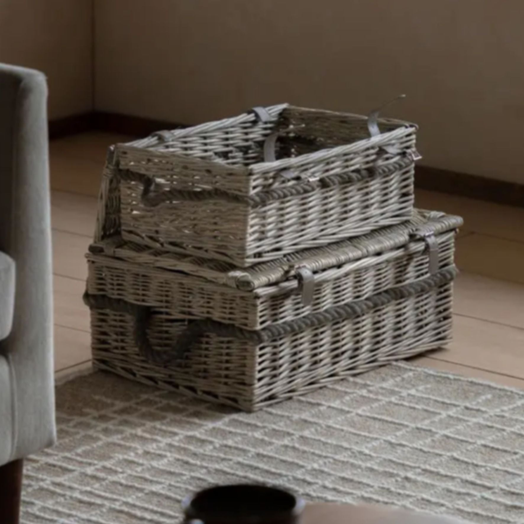 lidded baskets stacked on a rug with lids closed