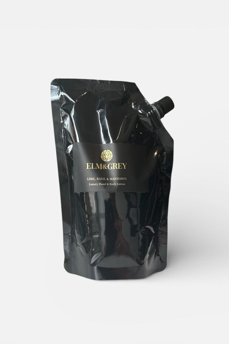 Black refill pouch packaging for hand lotion with Elm and grey branding on a white background