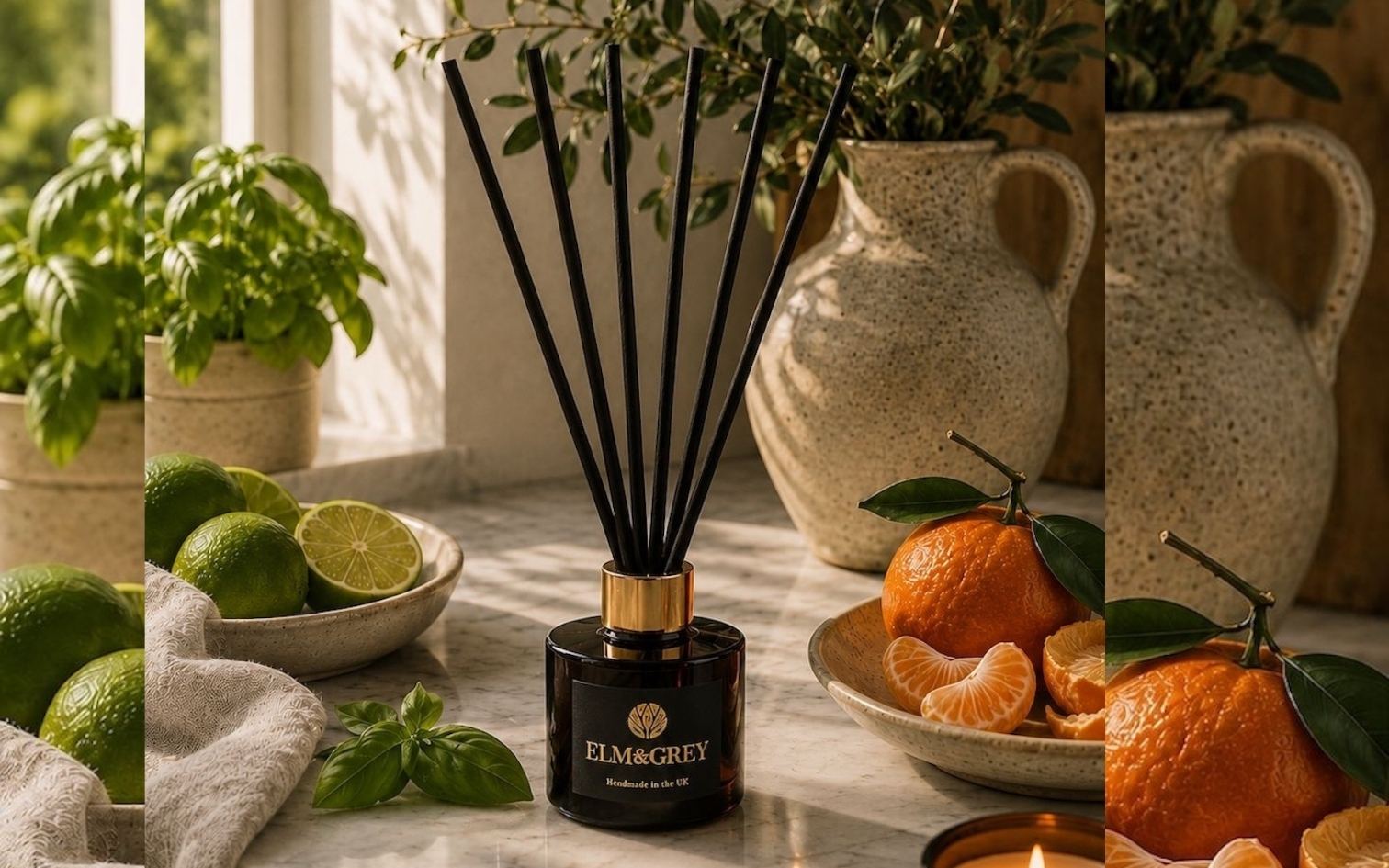 Elm and Grey Black diffuser with gold cap on a table with limes, oranges, and basil leaves.