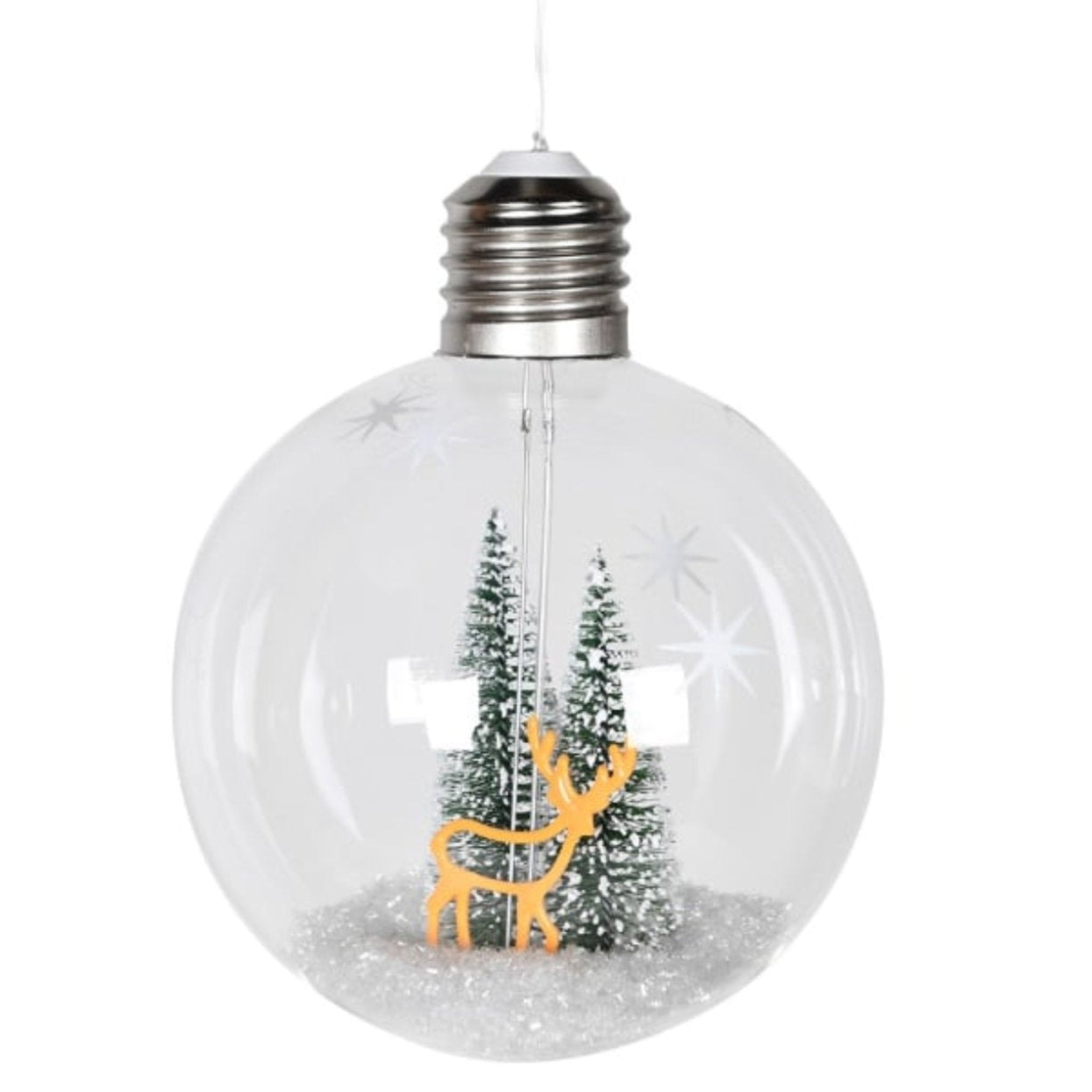 Clear glass Christmas ornament with reindeer and trees inside, on a white background