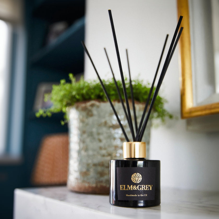 Elm & Grey diffuser on a countertop with a blurred background
