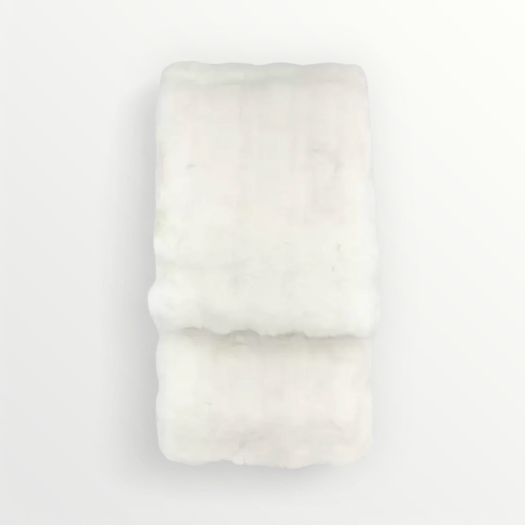 White fabric roll on a light gray background