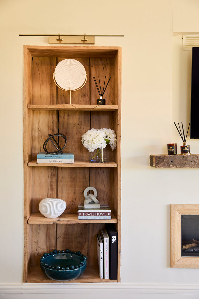 Shelves with decorative accessories on including bobble vase white vase hydrangeas knot metal objet and diffuser