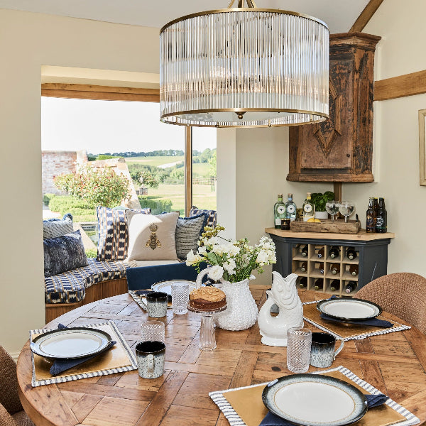 Breakfast table with urchin jug gluggle jug wooden breakfast gin drinks tray and bee cushion on it