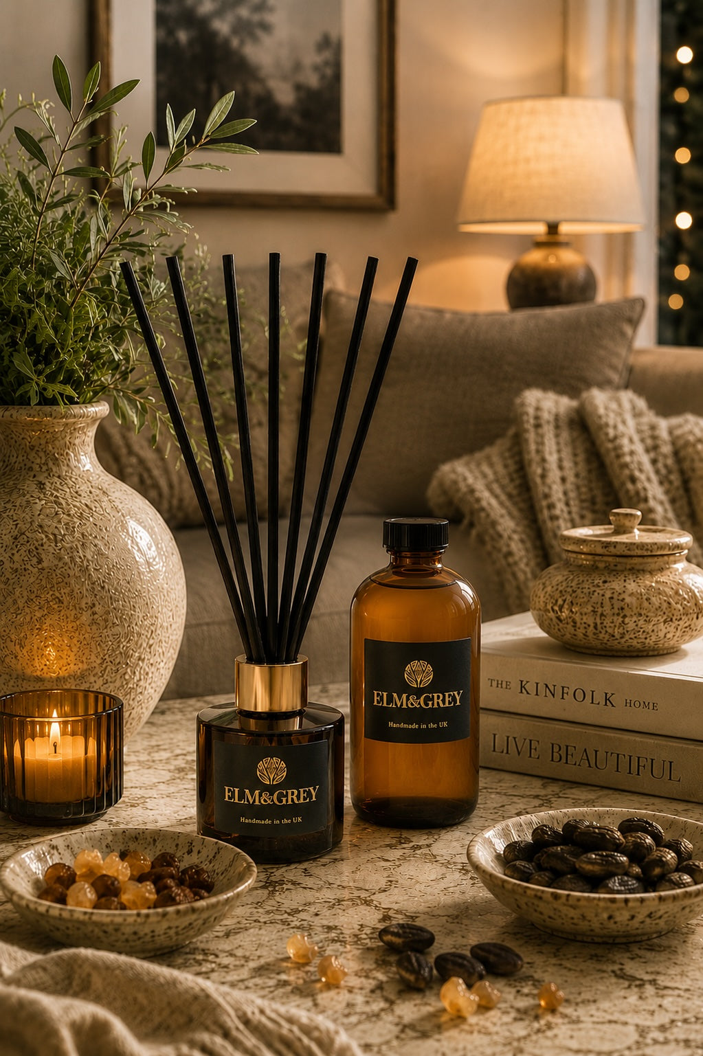 Myrrh and tonka diffuser and diffuser refill bottle on a marble table in a cosy living room setting.