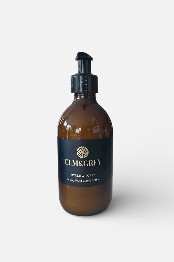 Myrrh and Tonka fragranced Amber bottle with pump dispenser labeled 'Elm&Grey' on a white background