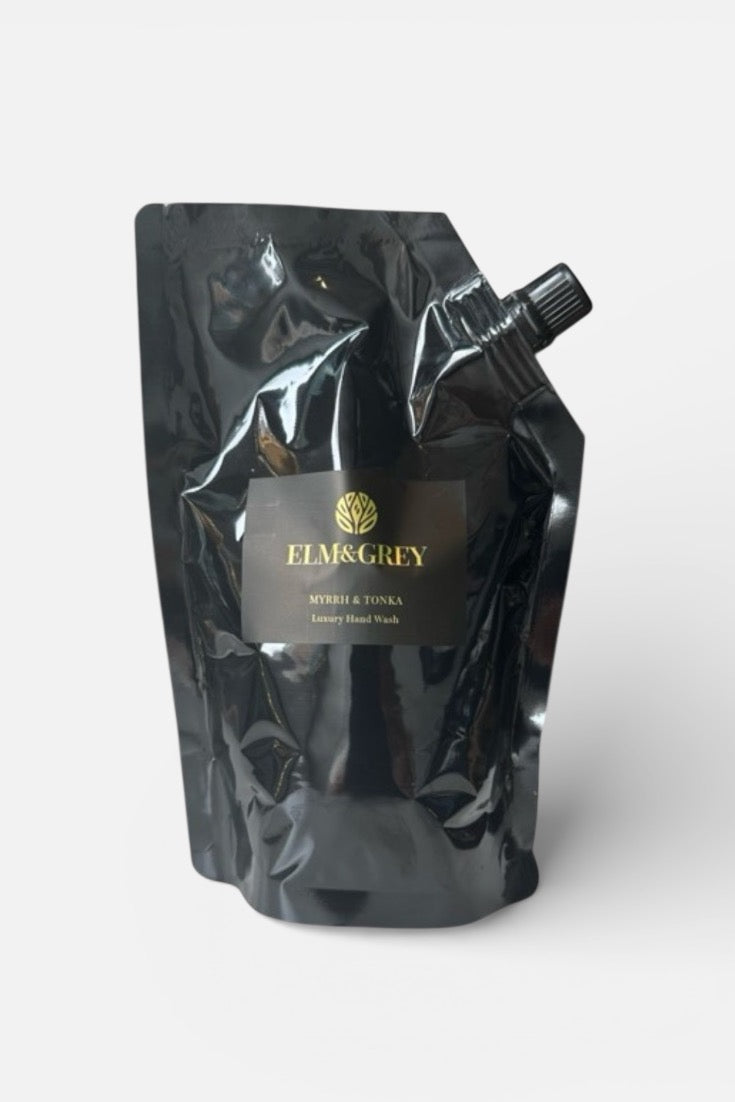Black refill hand wash pouch with 'Elm & Grey' branding on a white background