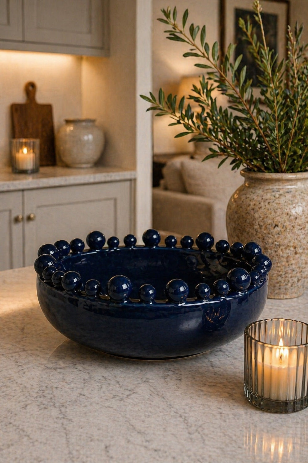Deep navy bobble-edged ceramic decorative bowl on white background — Elm & Grey