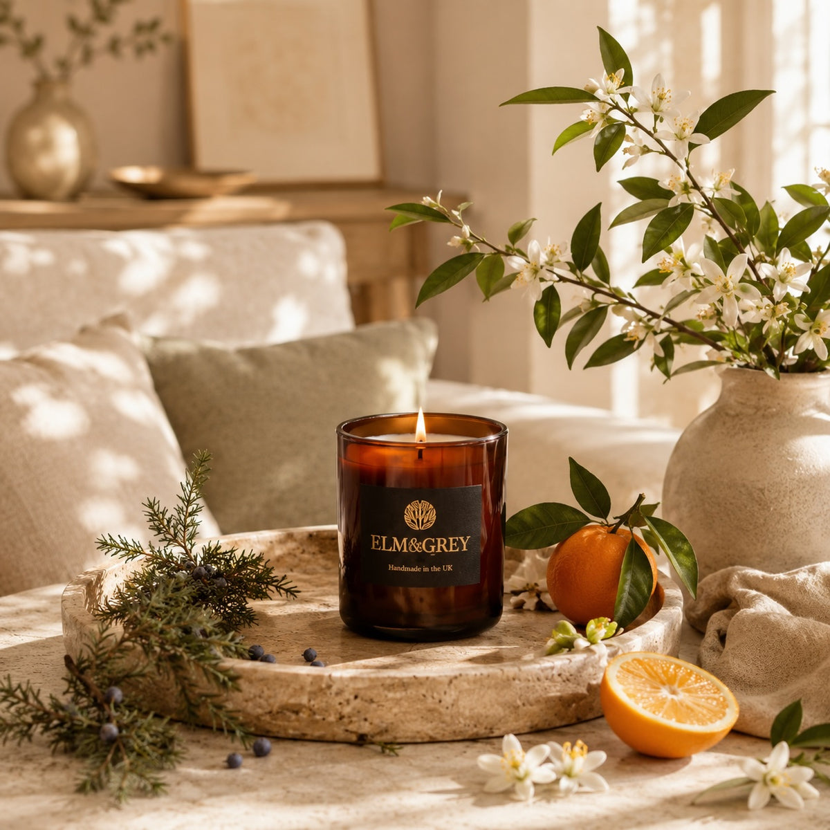Elm & Grey Orange Blossom & Juniper candle with orange blossom and juniper in a bright sunlit room