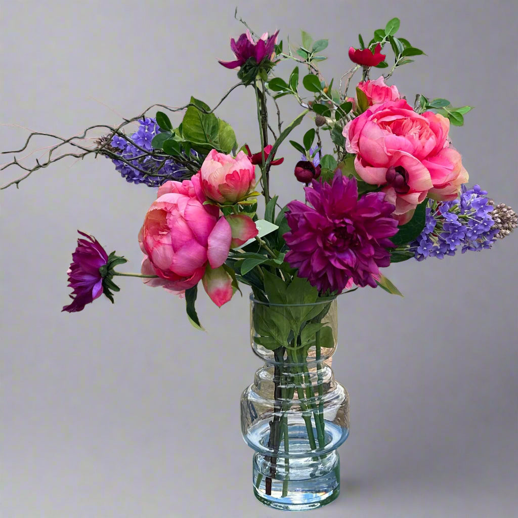 Vase of pink and purple flowers