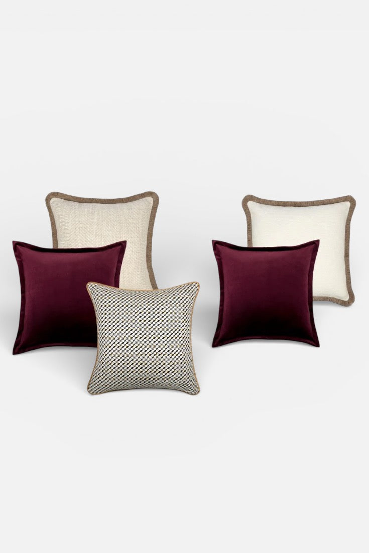 Set of decorative pillows in various patterns and colors on a white background