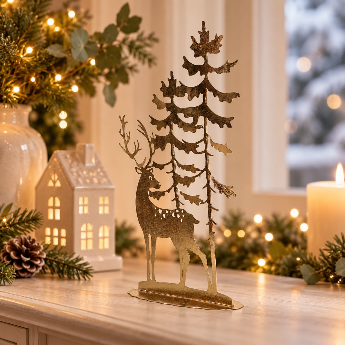 Savernake Reindeer Scene styled with candlelight and festive greenery