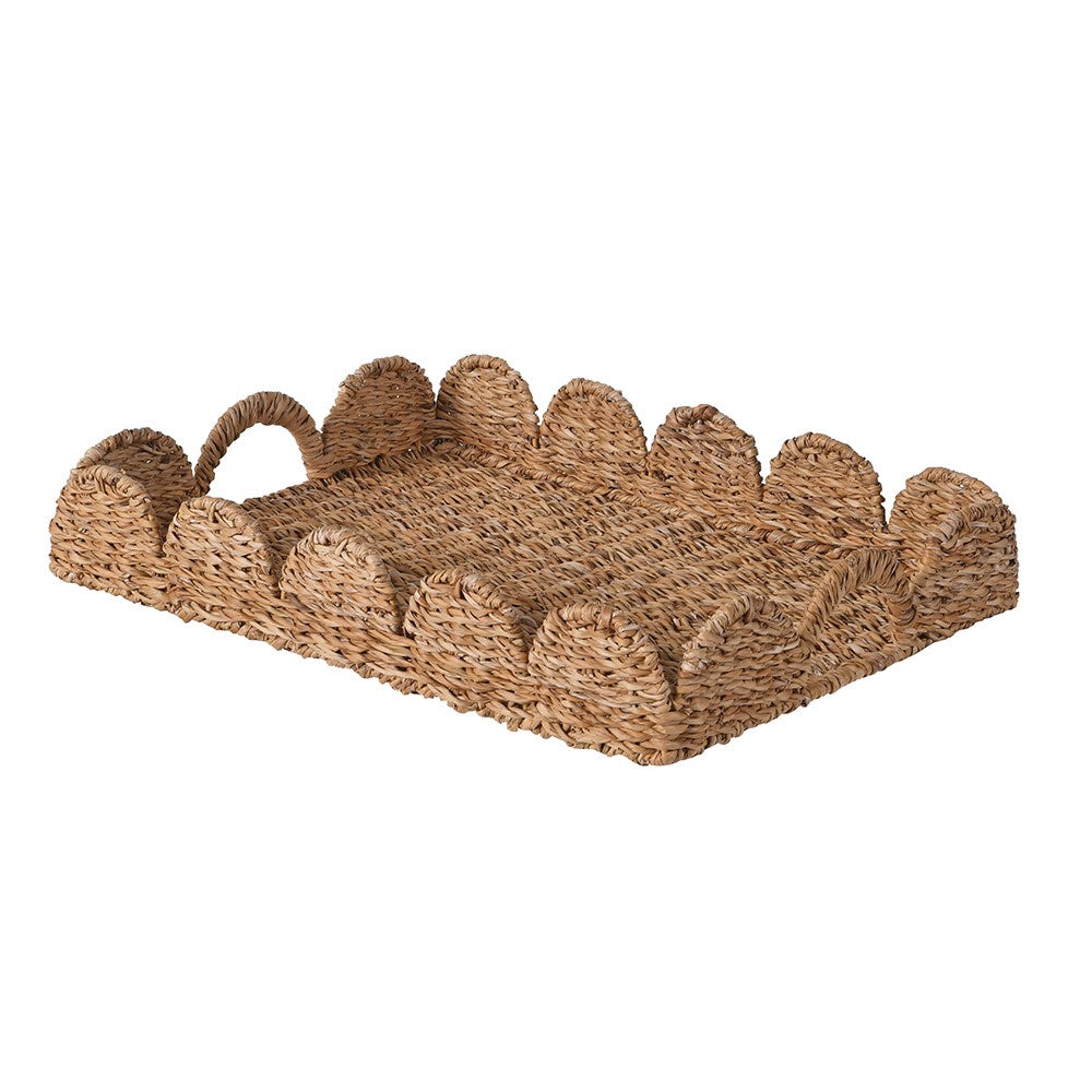 Woven basket with leaf-like design on a white background