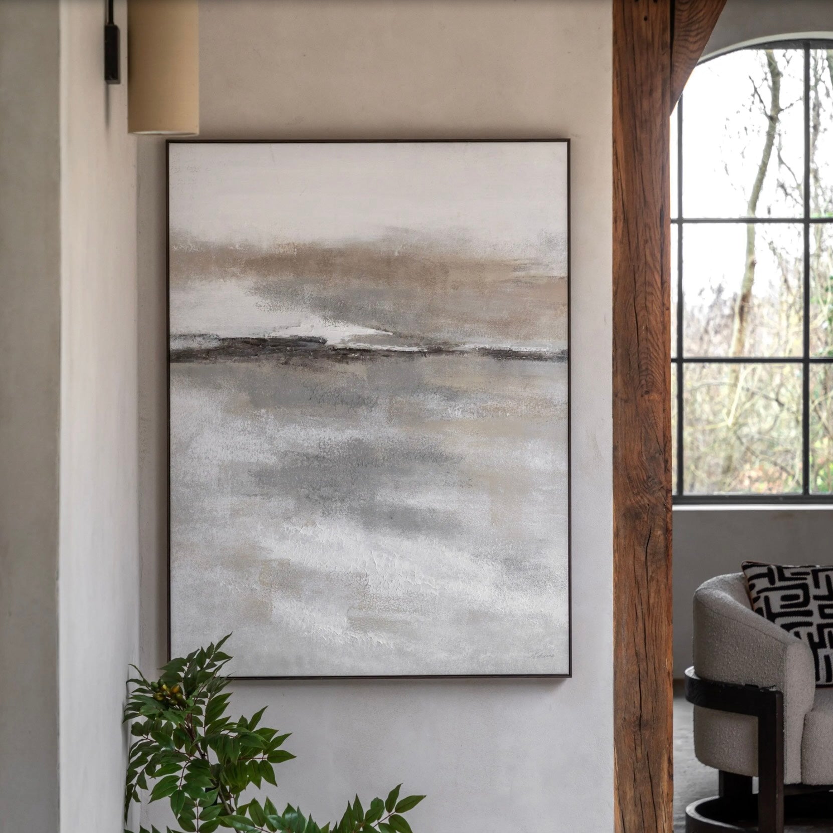 Serene abstract painting on a wall in a room with a window and plant by Elm & Grey