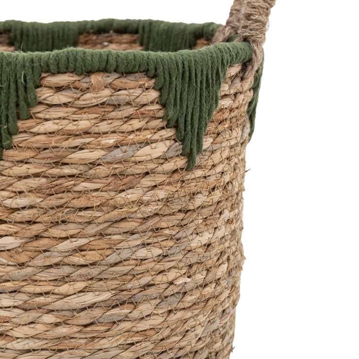 Woven basket with green lining on a white background