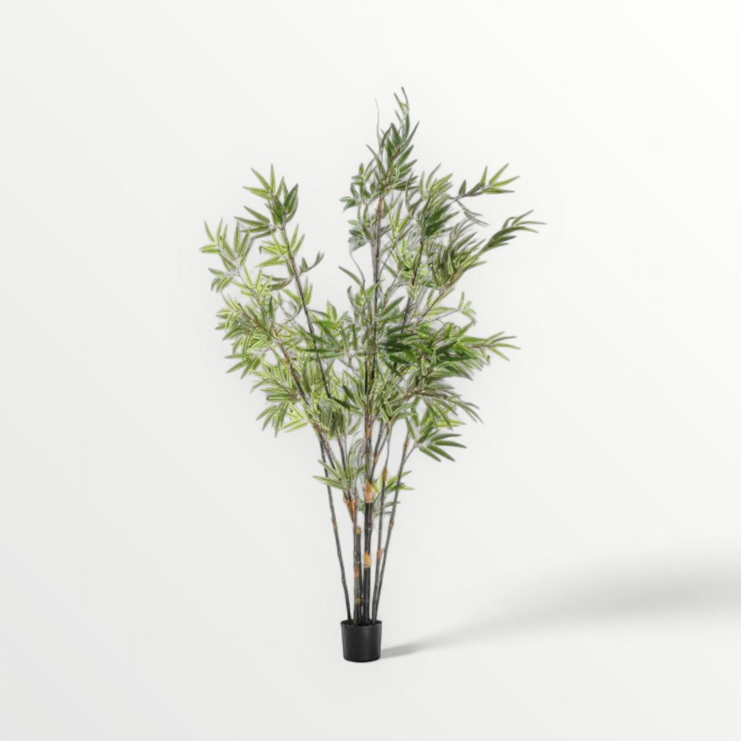 A realistic artificial tall potted bamboo plant with lush green foliage in a black pot against a white background.