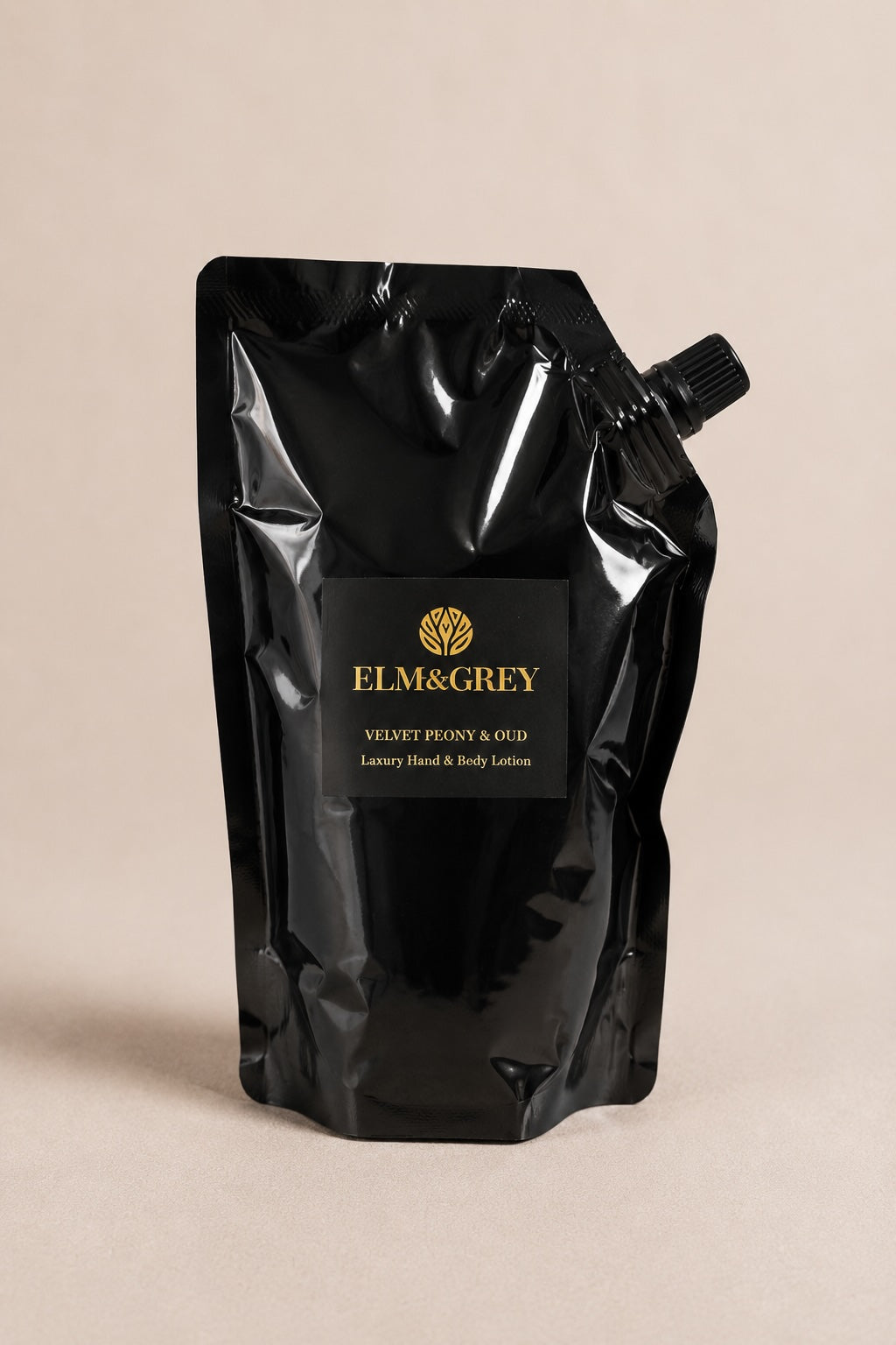 Elm & Grey Velvet Peony & Oud hand and body lotion refill pouch on a neutral studio background