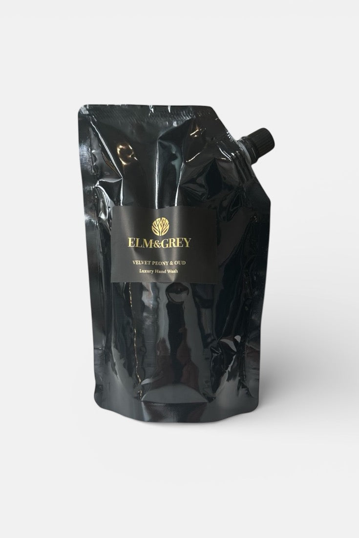 Black refill pouch for velvet peony and oud hand wash packaging with 'ELM & GREY' branding on a white background
