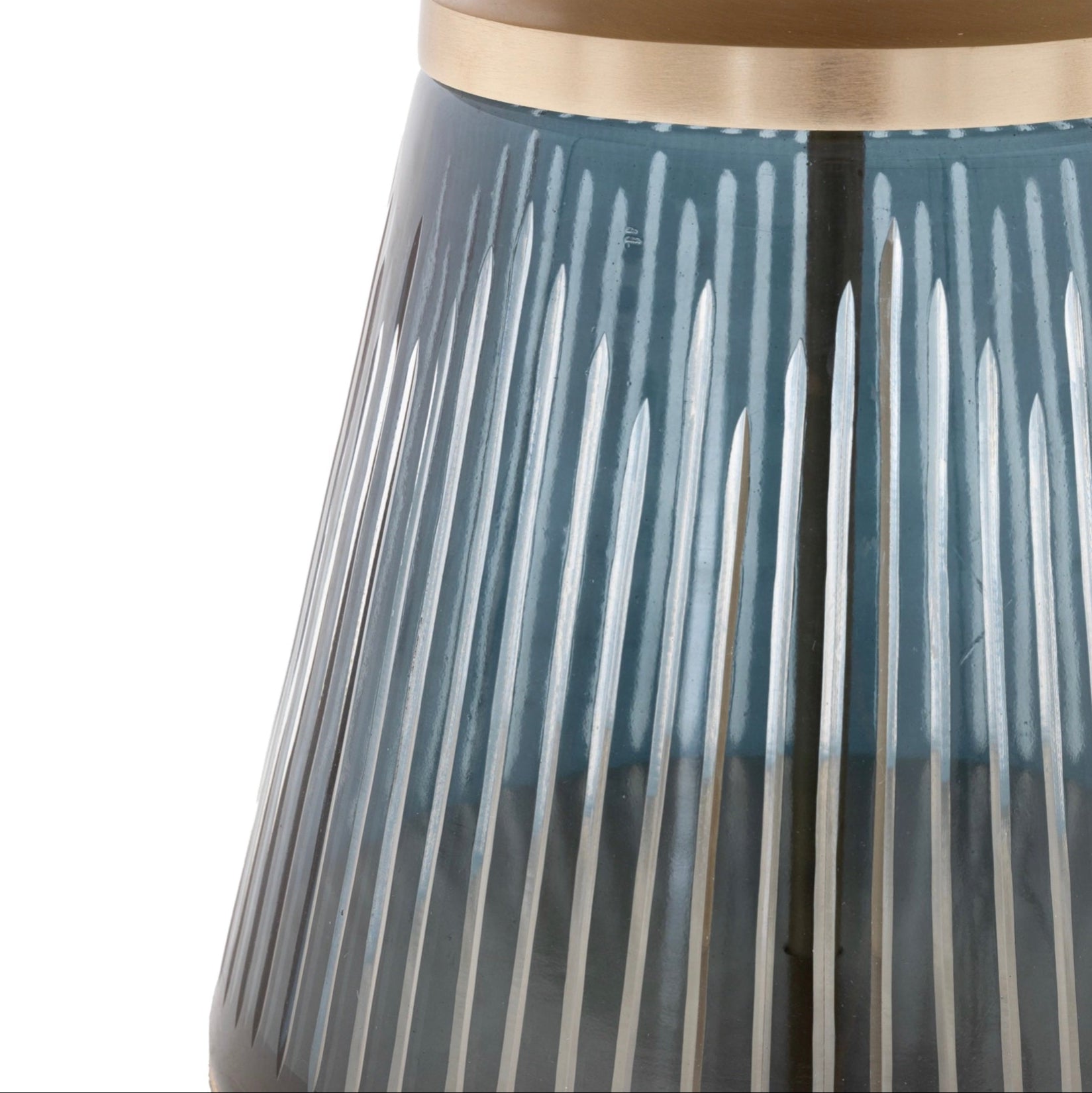 Close-up of a blue glass coffee table base with a ribbed design