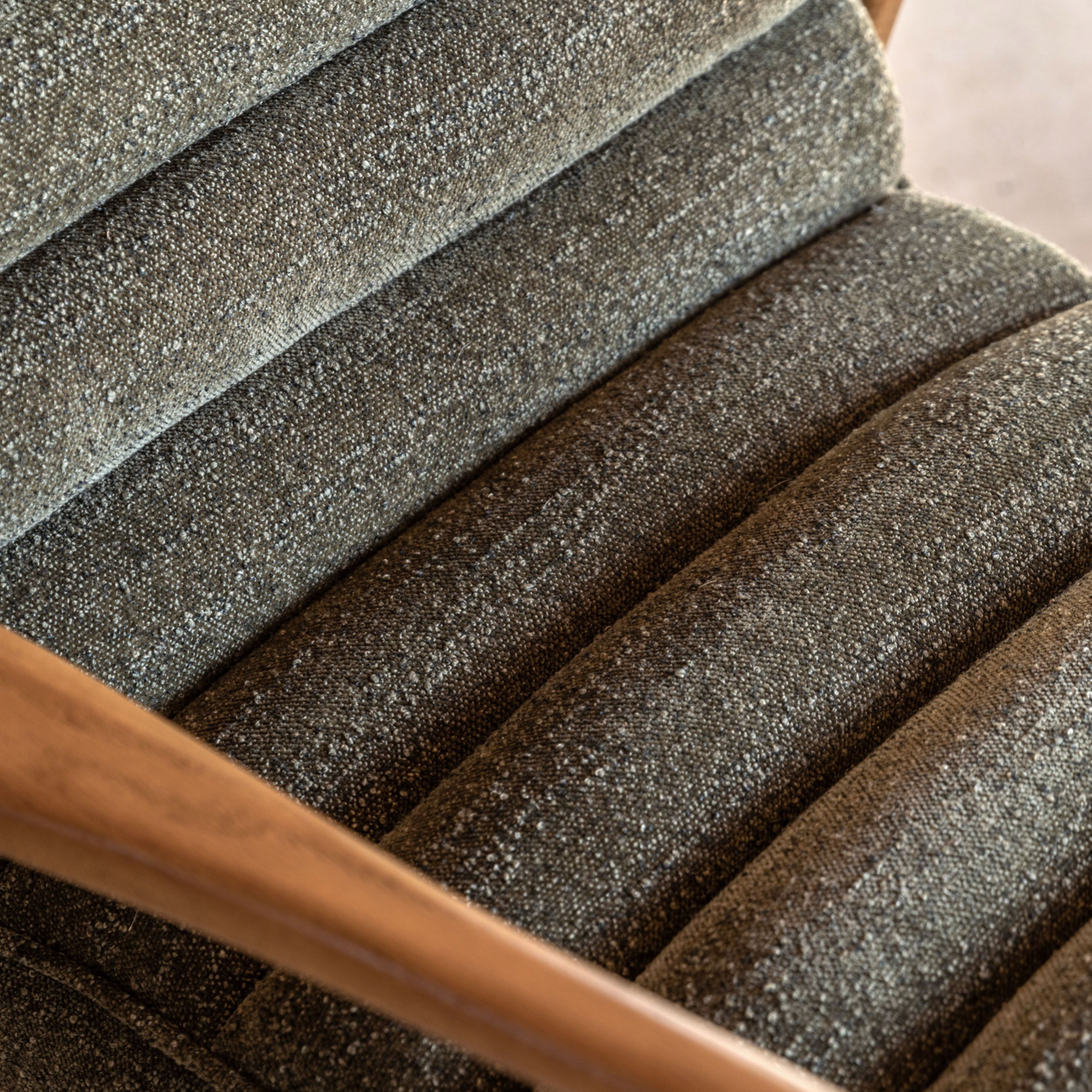 Close-up of textured gray fabric with wooden handle