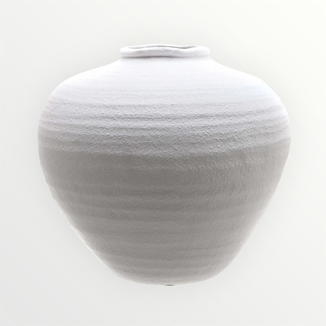 White textured stone vase on a white background
