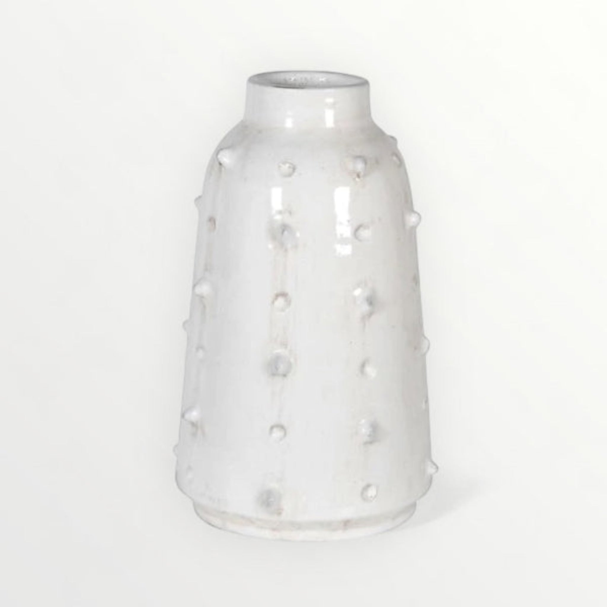 White textured ceramic vase with bobble detail on a white background