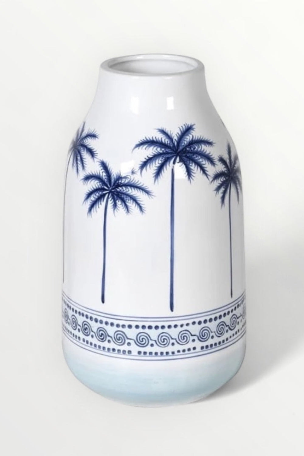 White vase with blue palm tree design on a white background