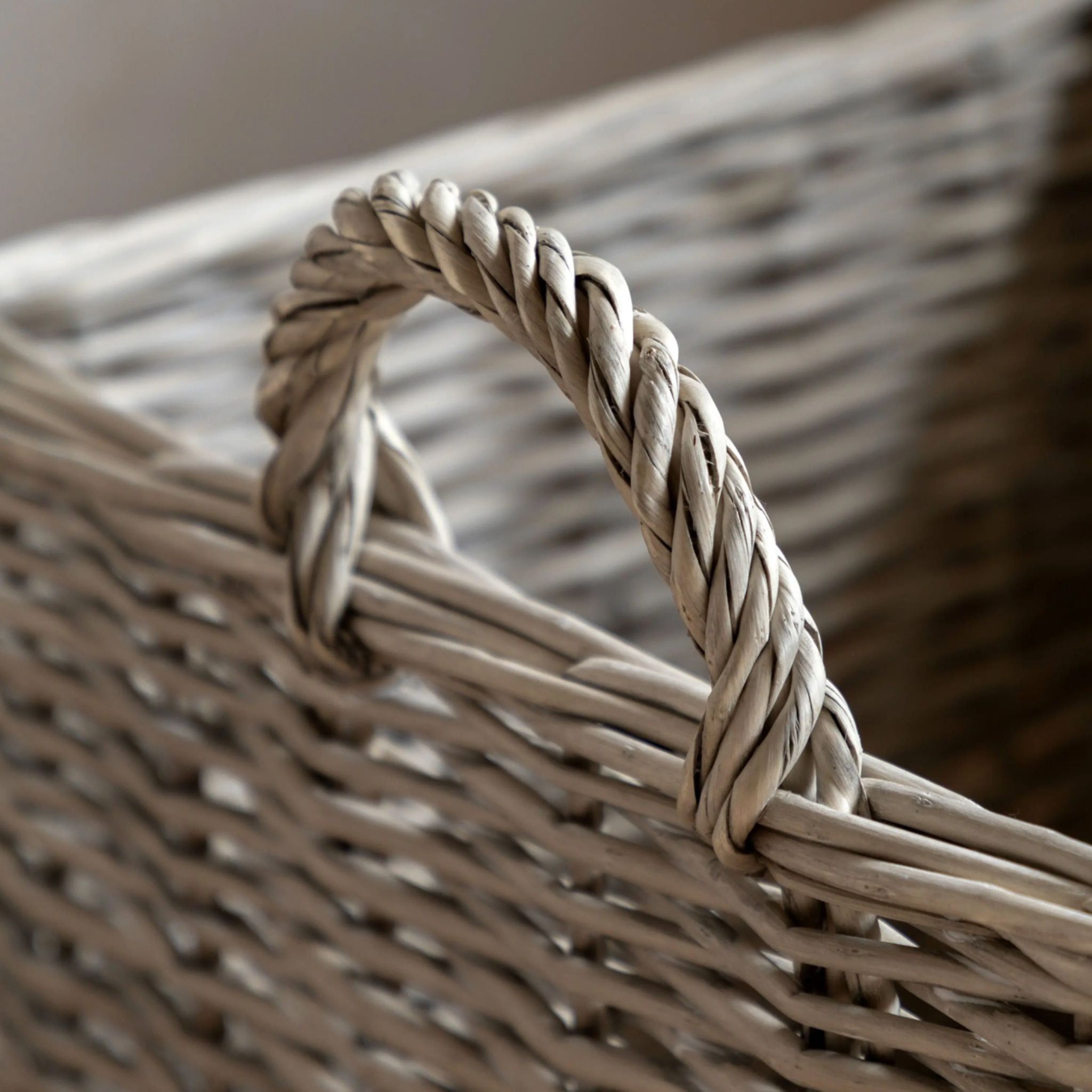 Close-up of a woven basket with a braided handle.