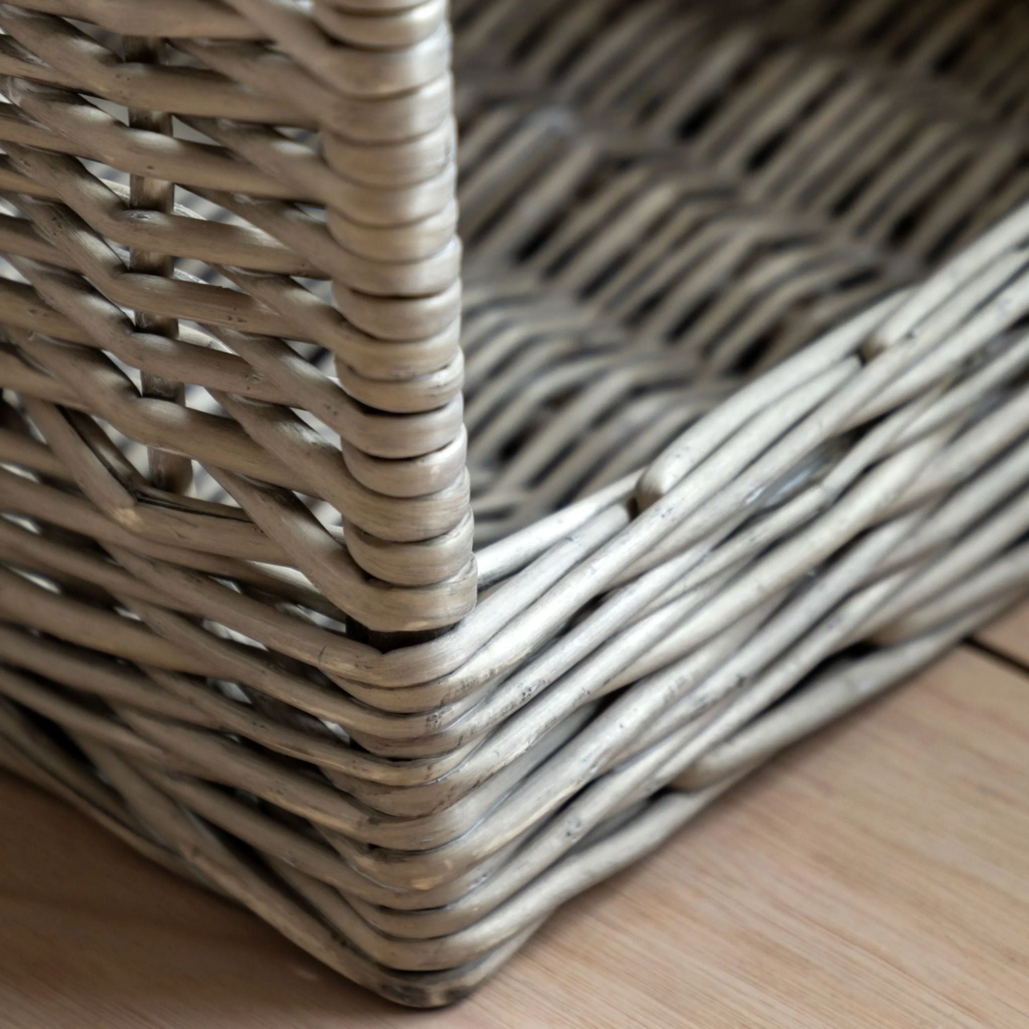 Close-up of a wicker basket corner on a wooden surface