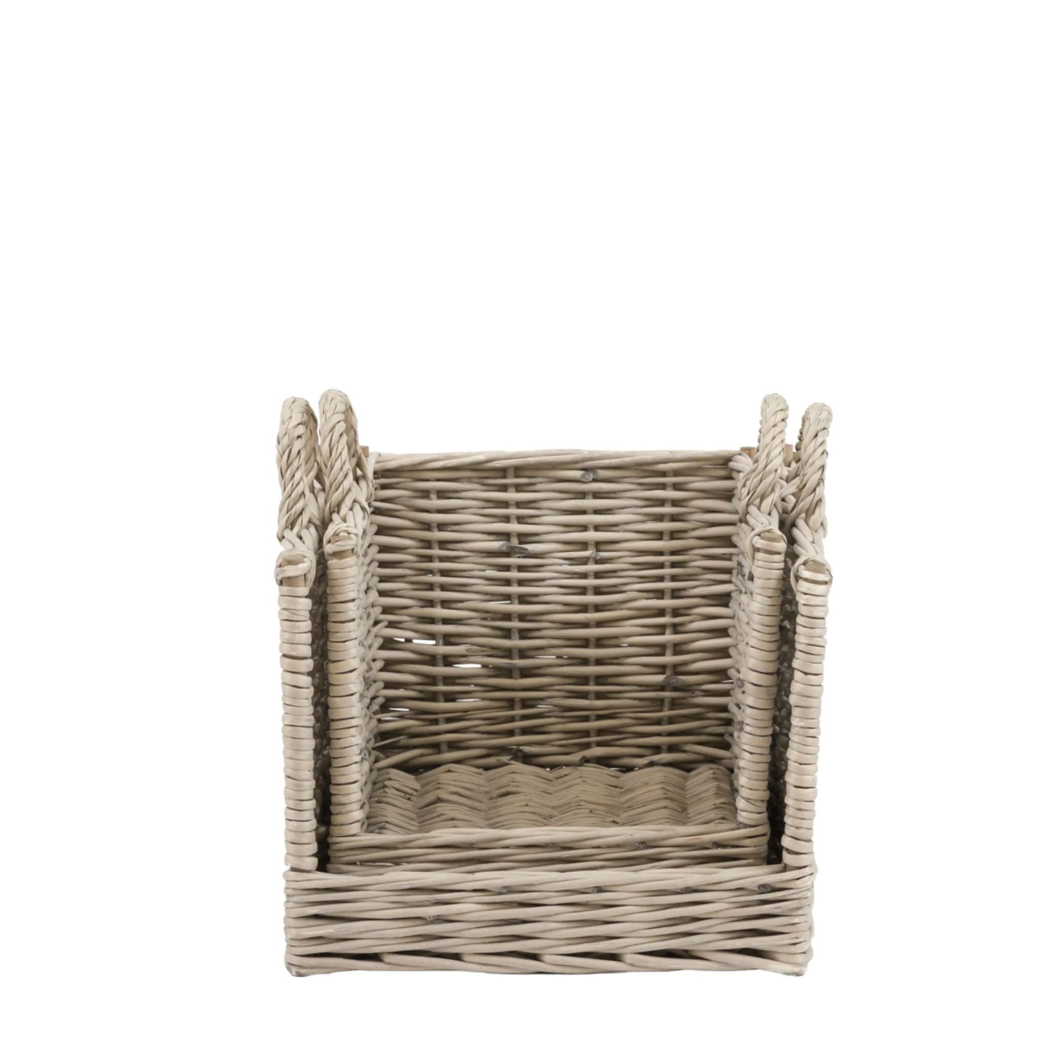 Wicker basket with handles on a white background