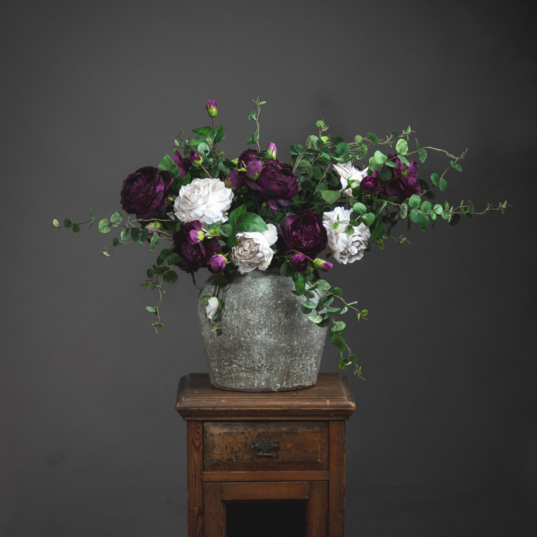 cement vase on a plinth