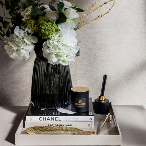 Curated tray with grey pleat vase and coordinated collection of accessories