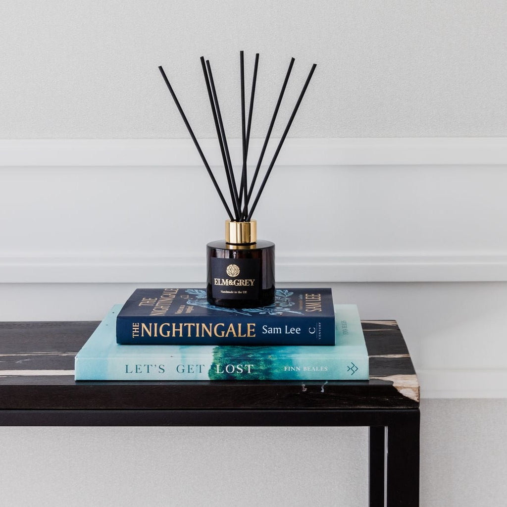 Luxury Reed Diffuser on stack of books