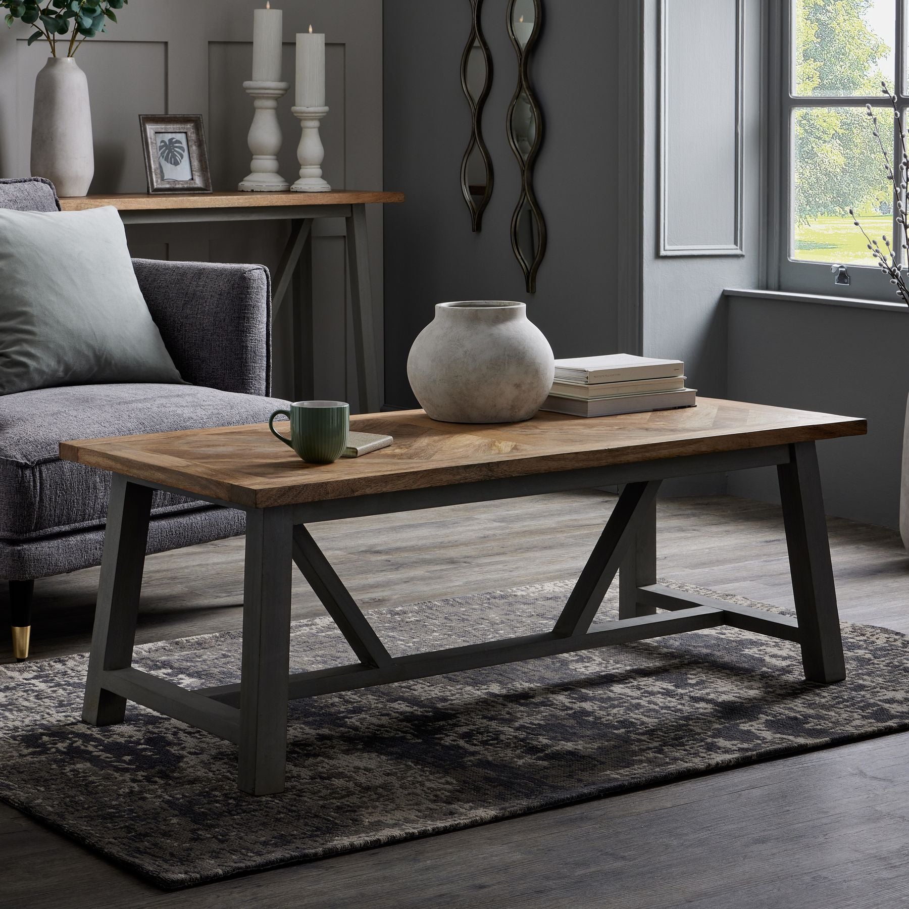 Grey-white ceramic planter on a coffee table