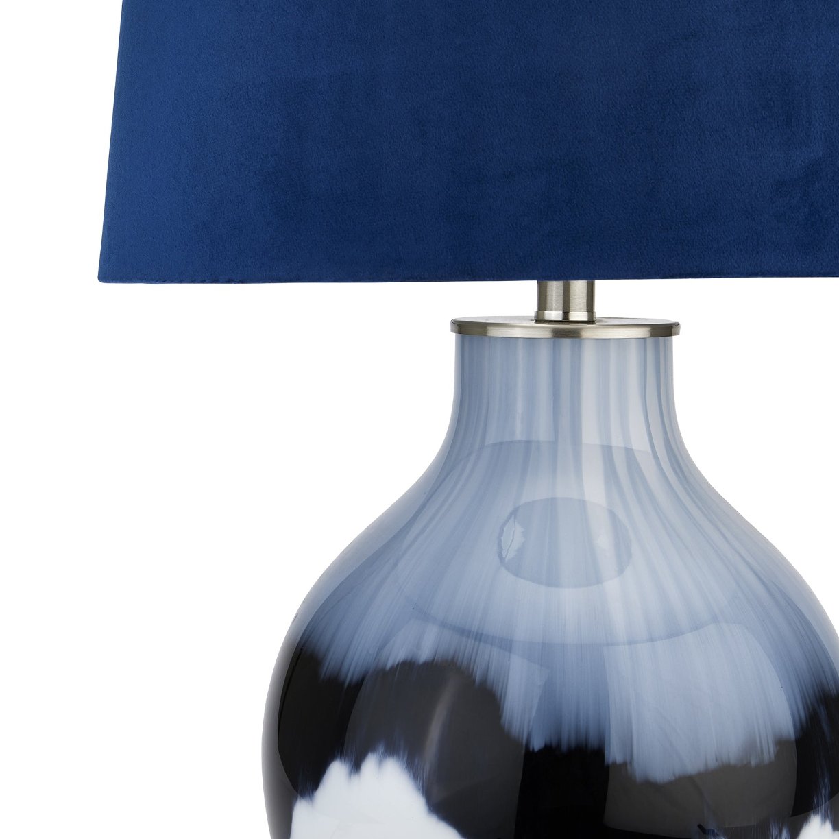 close up of glazed ceramic lamp with navy blue lampshade